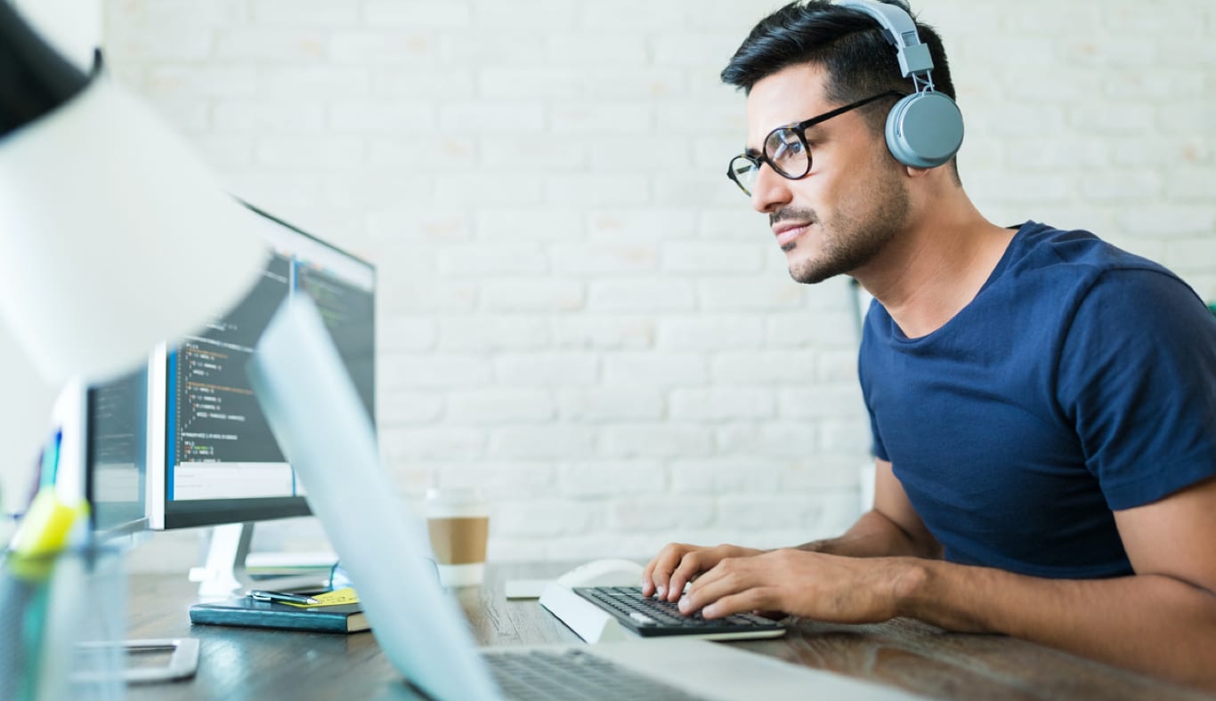 A professional designer at work on a computer.