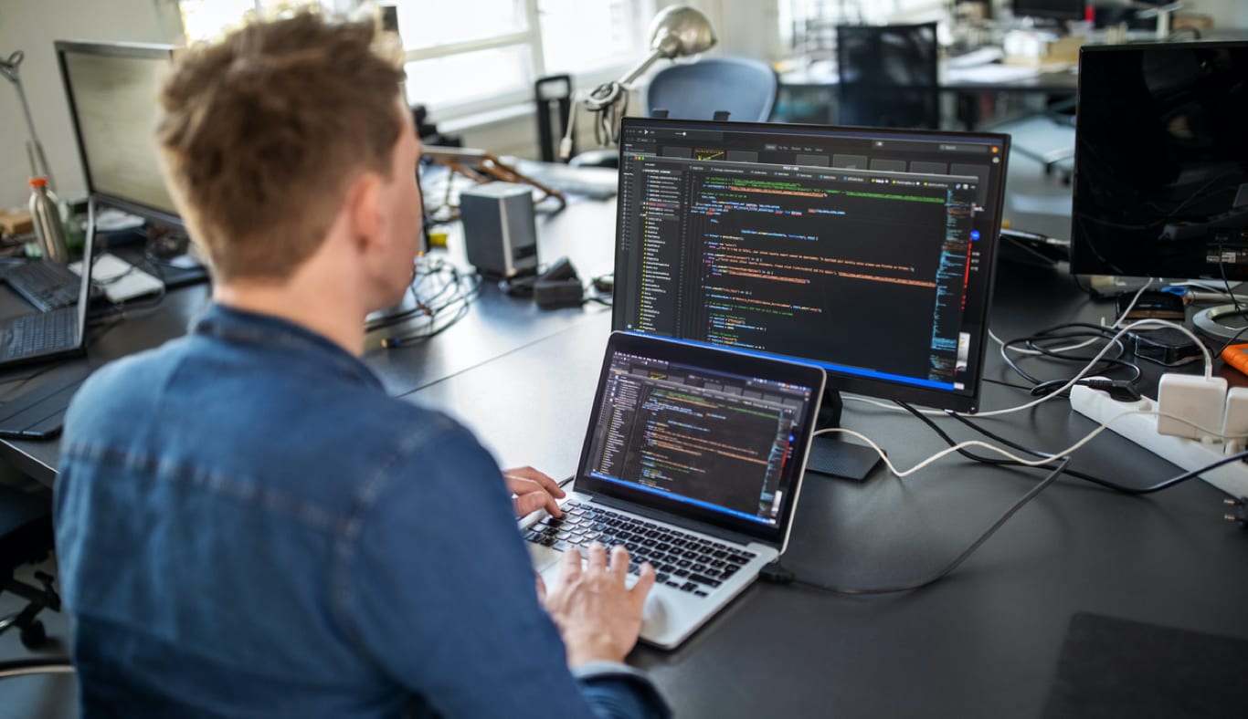 A professional developer writing code